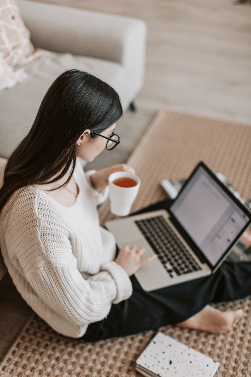 Woman on her laptop during online therapy