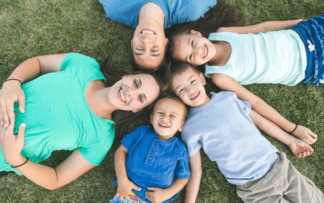 Family who is now fostering a child after they learnt how to become a licensed foster parent